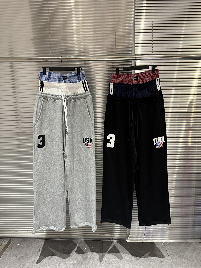 Streetwear Brand Usa - กางเกงสเวตแพนท์แฟชั่นสตรีทแบรนด์ 25SS ทรงสามชั้นเอวผูกเชือก ปักลายธงชาติอเมริกา แต่งผ้าแบบแพทช์เวิร์ค ขากว้าง
